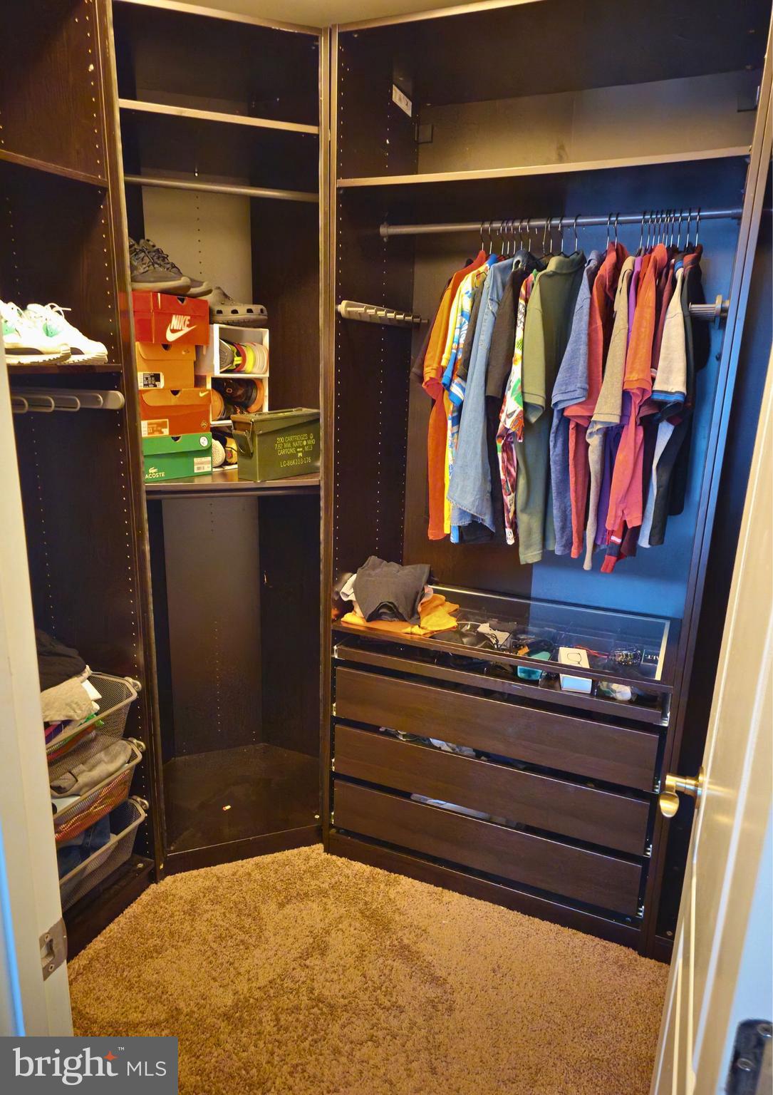 8120 Dalton Way Hanover, MD 21076 - Photo 12 of 22 a view of walk in closet with clothes and shoes