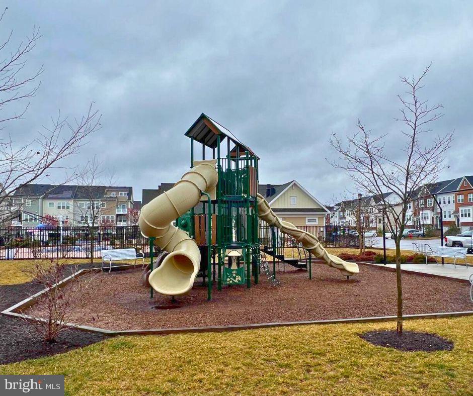 8120 Dalton Way Hanover, MD 21076 - Photo 21 of 22 a swimming pool with some trees in the background