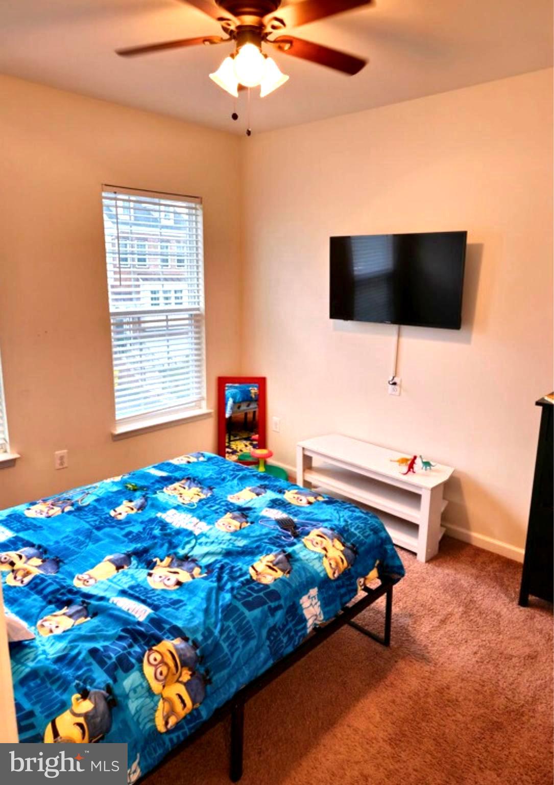 8120 Dalton Way Hanover, MD 21076 - Photo 7 of 22 a bedroom with a bed and flat screen tv