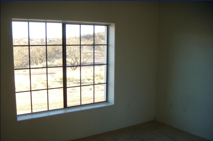 375 Via Papagayo Rio Rico, AZ 85648 - Photo 6 of 6 an empty room with a window