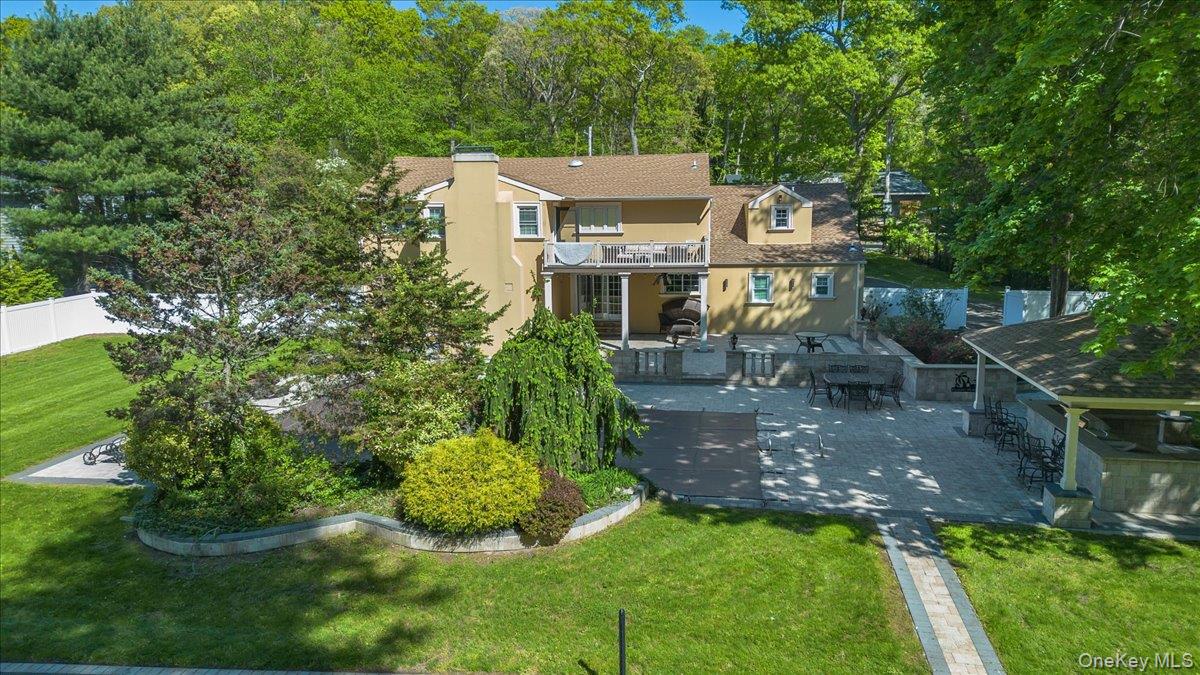 626 Caledonia Road Dix Hills, NY 11746 - Photo 36 of 49 an aerial view of a house with a yard