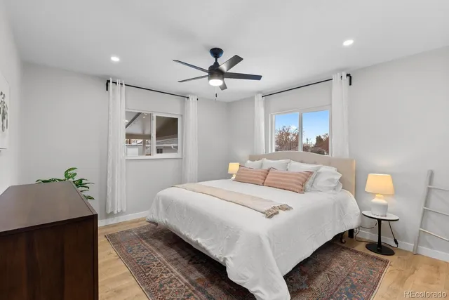 a bedroom with a large bed and a window