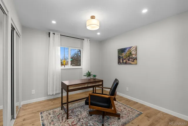 a view of a livingroom with furniture and furniture