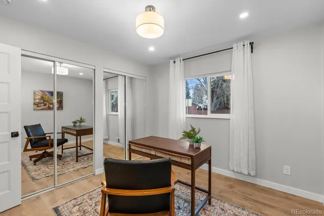 a living room with furniture and a rug