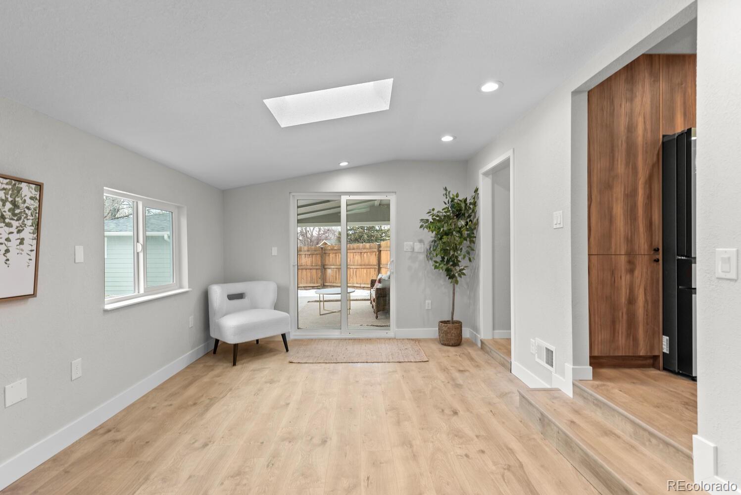 1711 South Forest Street Denver, CO 80222 - Photo 22 of 44 a living room with furniture window and wooden floor