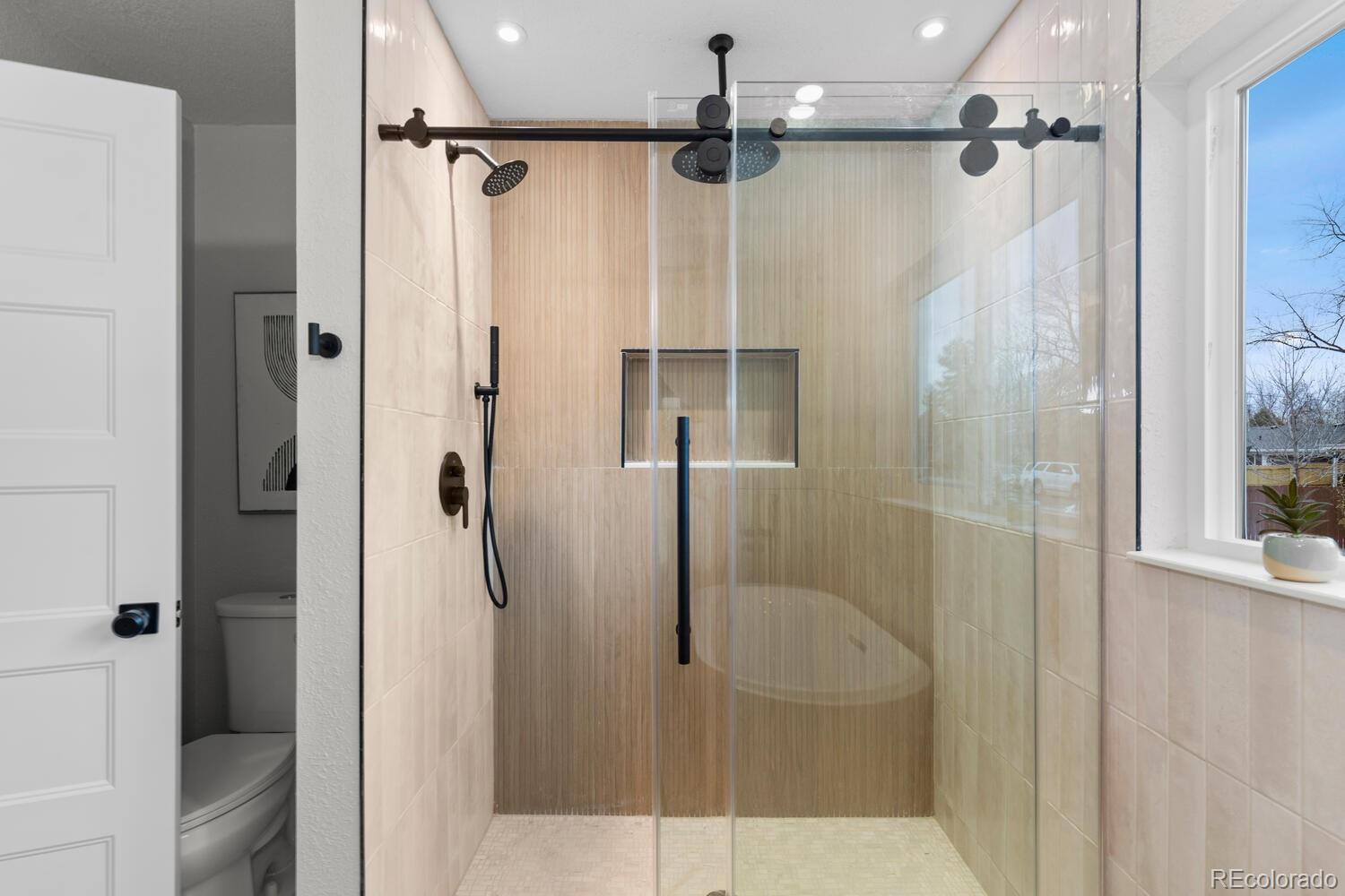 1711 South Forest Street Denver, CO 80222 - Photo 26 of 44 a bathroom with a shower