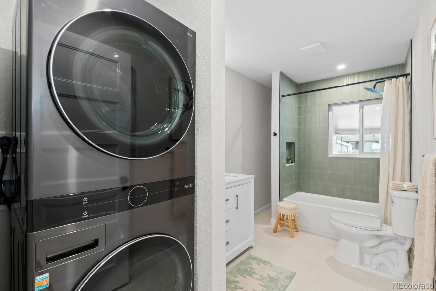1711 South Forest Street Denver, CO 80222 - Photo 28 of 44 a bathroom with a sink and mirror