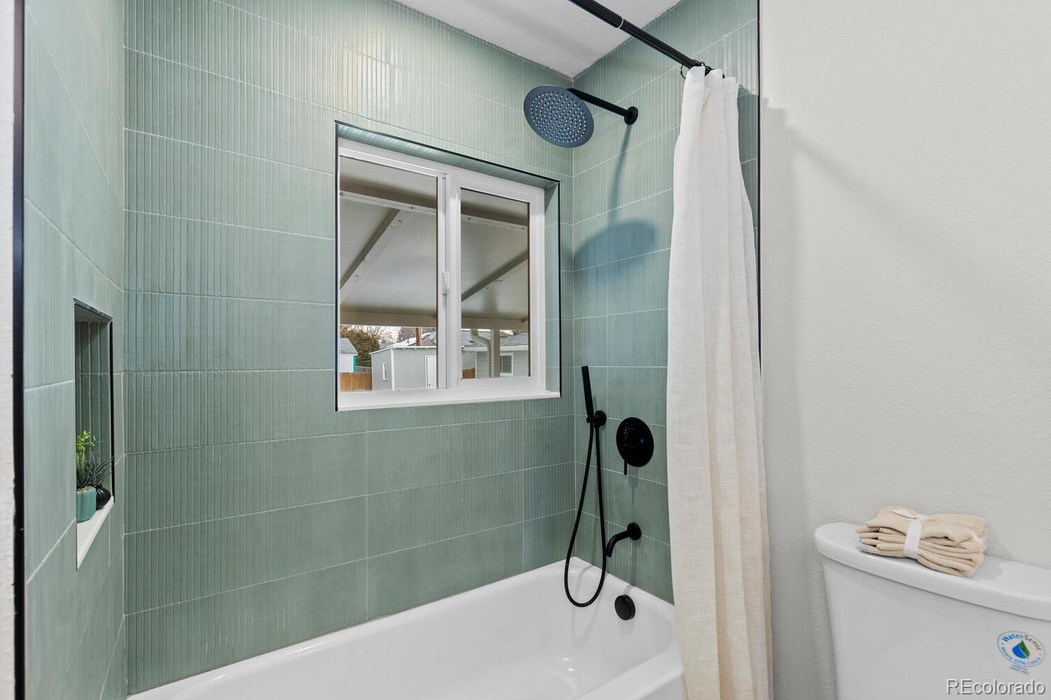 1711 South Forest Street Denver, CO 80222 - Photo 30 of 44 a bathroom with a shower