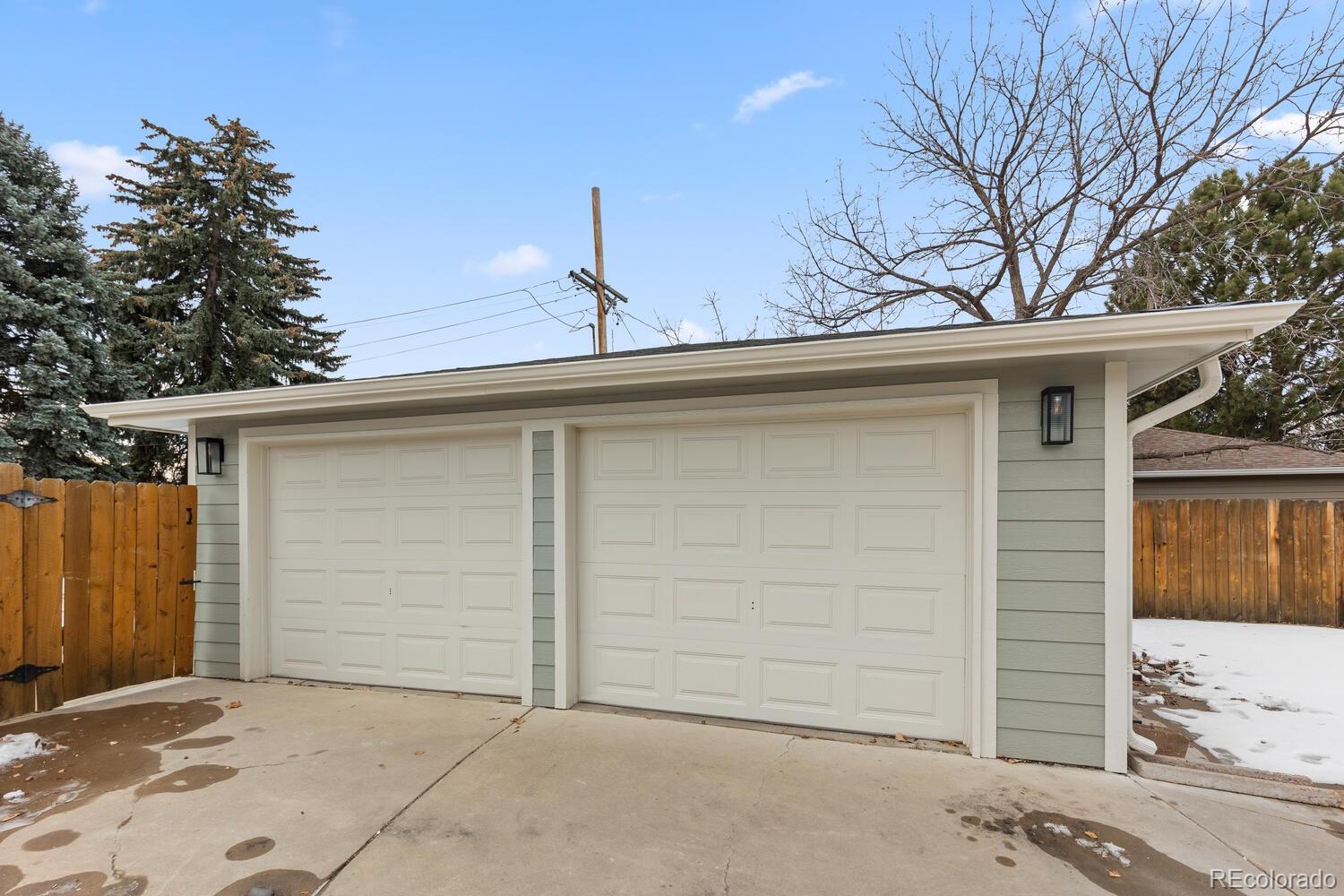 1711 South Forest Street Denver, CO 80222 - Photo 33 of 44 a side view of a house with a garage