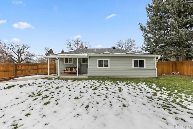 an aerial view of residential houses with outdoor space and parking