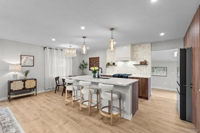 a large kitchen with a table and chairs
