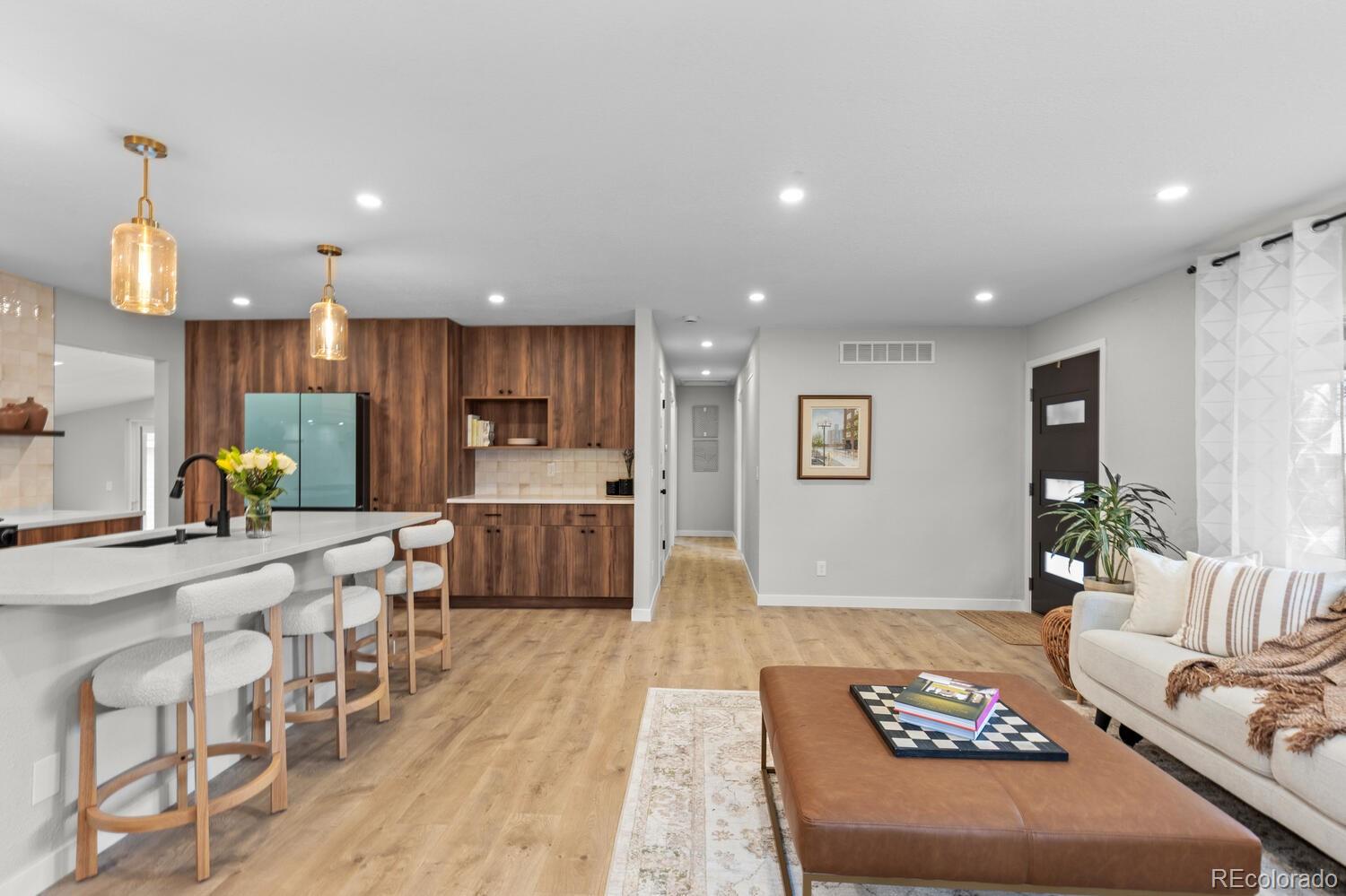 1711 South Forest Street Denver, CO 80222 - Photo 5 of 44 a large kitchen with a table and chairs