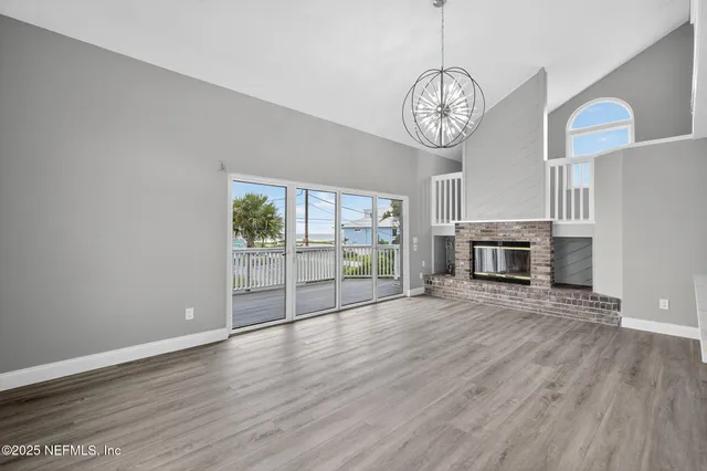 a view of fireplace and wooden floor