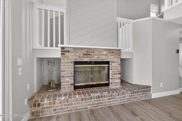 a view of a balcony with wooden floor