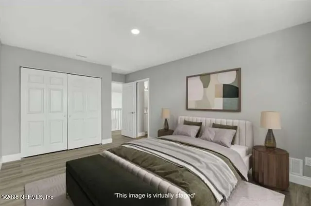 a view of an empty room and wooden floor