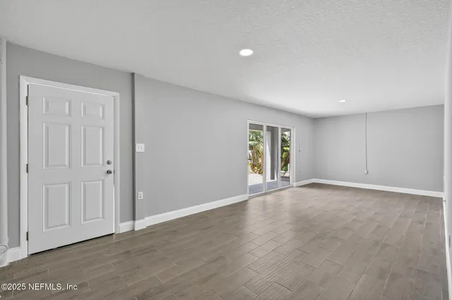 a view of a house with pool and sitting area