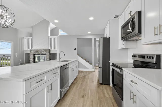 a view of entryway with wooden floor