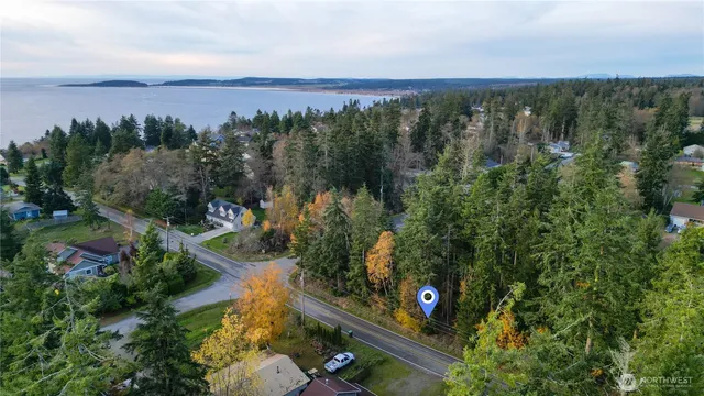 a front view of a house with a street