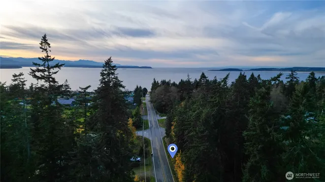 a view of a lake and a yard from balcony