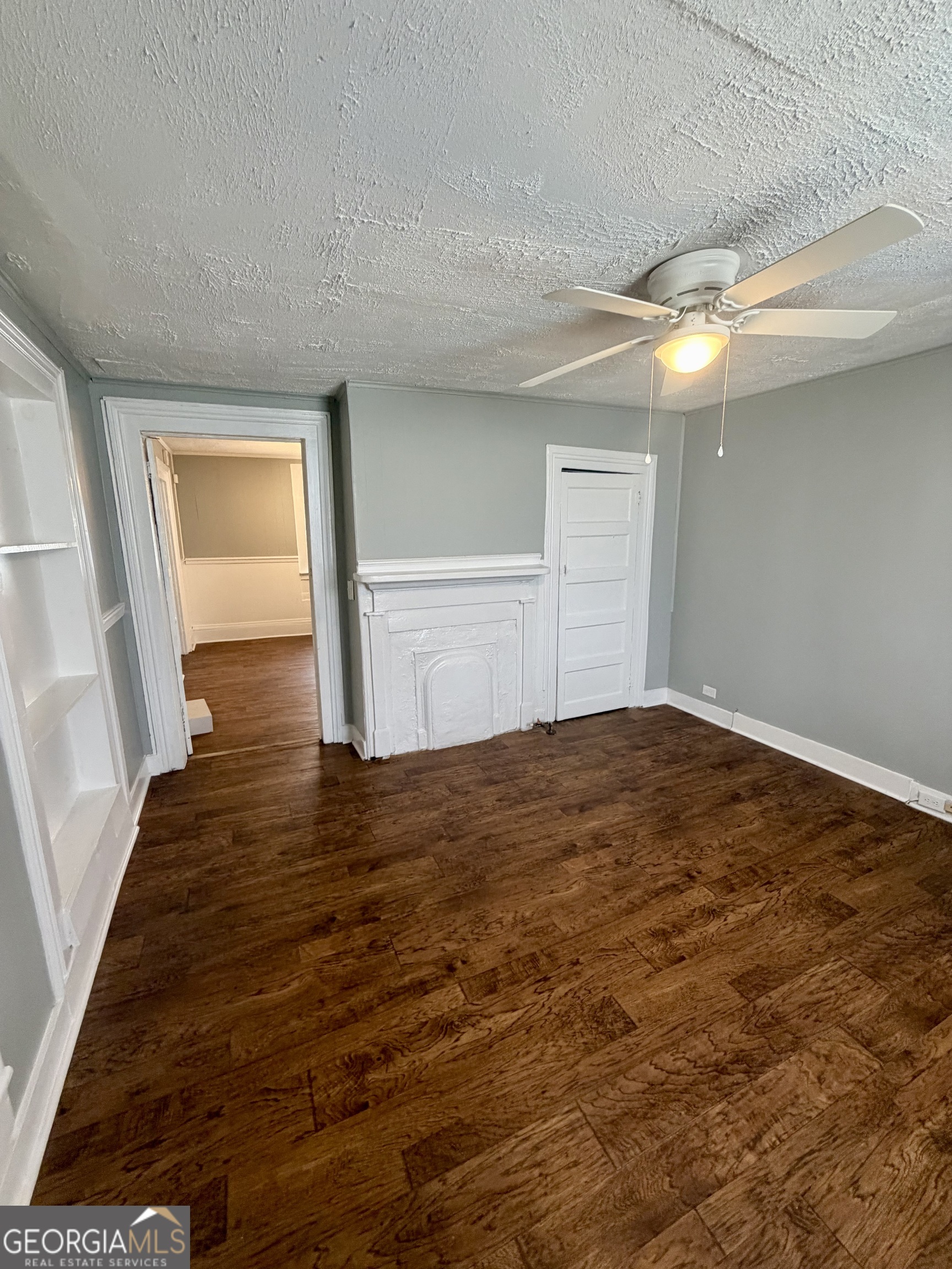 666 Woolfolk Street Macon, GA 31217 - Photo 18 of 60 a view of empty room with wooden floor