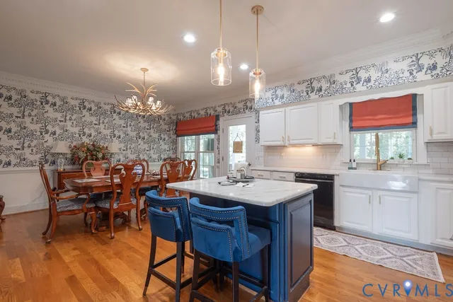 a view of a livingroom with furniture and a window