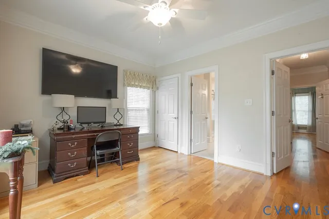 a bathroom with a granite countertop sink and a window