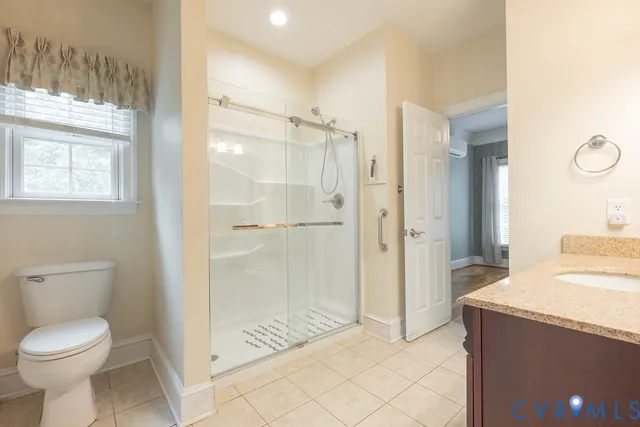 a view of a livingroom with furniture and windows