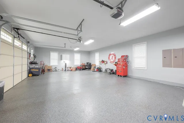 a bedroom with a bed and a mirror on dresser