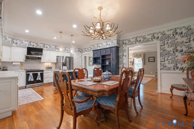 a kitchen with stainless steel appliances a sink a stove and a refrigerator