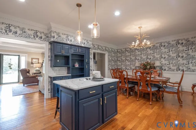 a bathroom with a granite countertop sink mirror and a bathtub