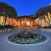 a view of a houses with a backyard