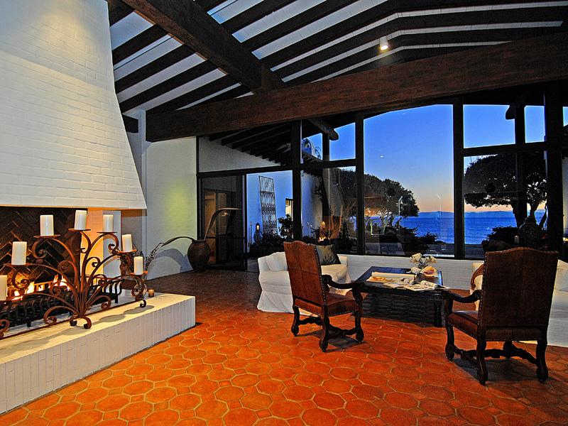 4347 Marina Drive Santa Barbara, CA 93110 - Photo 5 of 11 a living room with furniture a rug and a fireplace