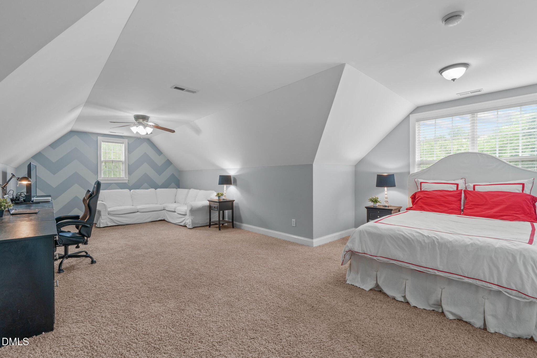 2450 Rolling Tracks Road Willow Spring, NC 27592 - Photo 39 of 64 a bedroom with a bed and a lamp