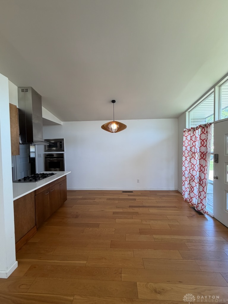 4924 Bayside Drive Riverside, OH 45431 - Photo 2 of 21 This inviting space features sleek appliances, warm wood floors, and abundant natural light.