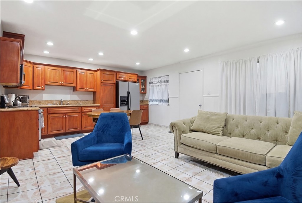 3301 Santa Fe Avenue, Unit 49 Long Beach, CA 90810 - Photo 11 of 26 a living room with furniture and kitchen view