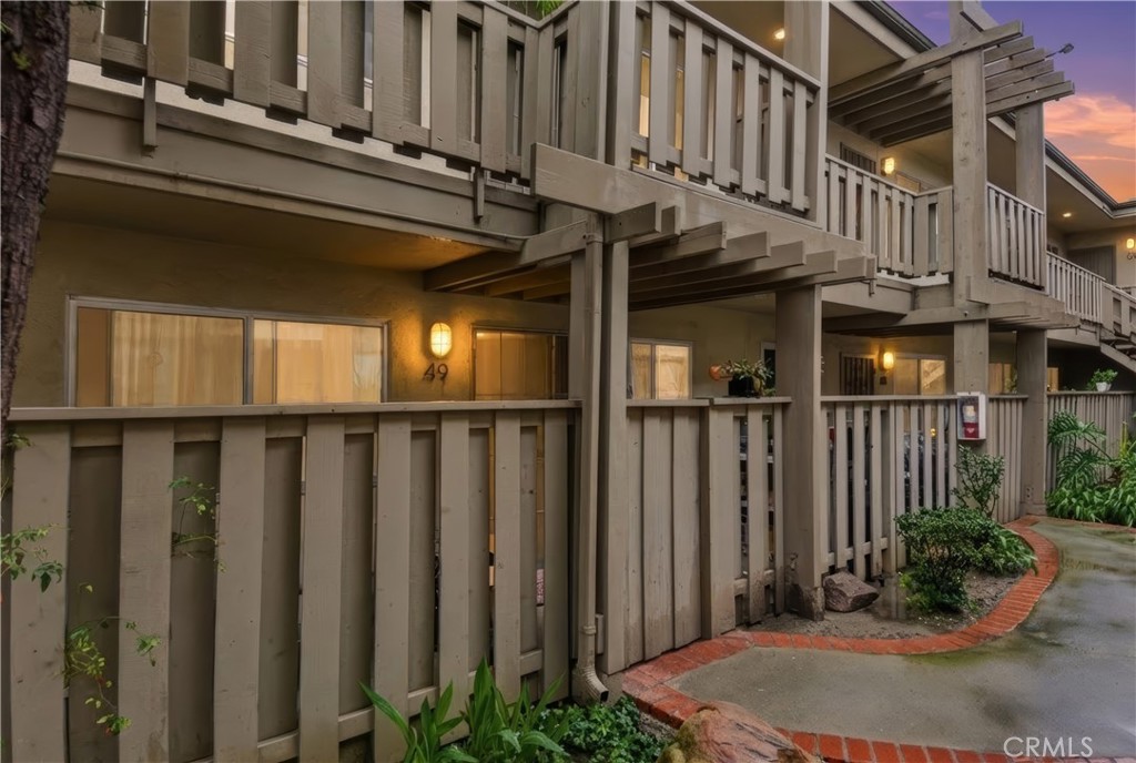 3301 Santa Fe Avenue, Unit 49 Long Beach, CA 90810 - Photo 19 of 26 a view of a house with wooden fence