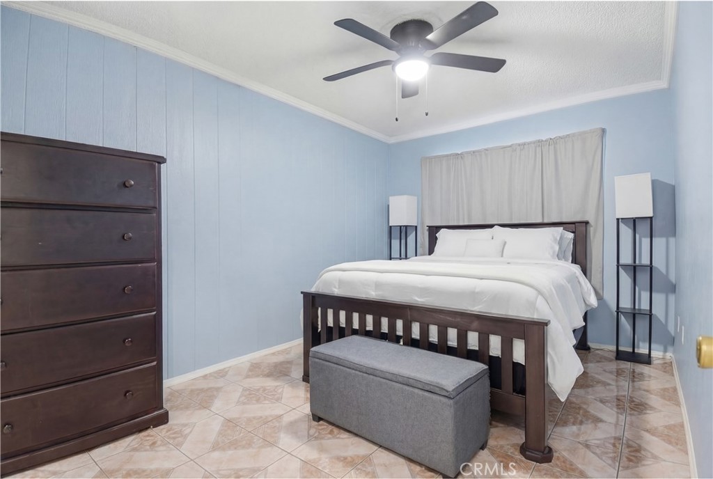 3301 Santa Fe Avenue, Unit 49 Long Beach, CA 90810 - Photo 24 of 26 a bed sitting in a bedroom chandelier
