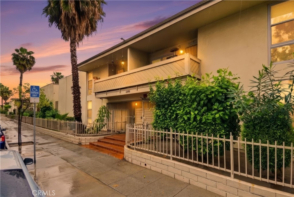 3301 Santa Fe Avenue, Unit 49 Long Beach, CA 90810 - Photo 3 of 26 a view of a street with a small yard
