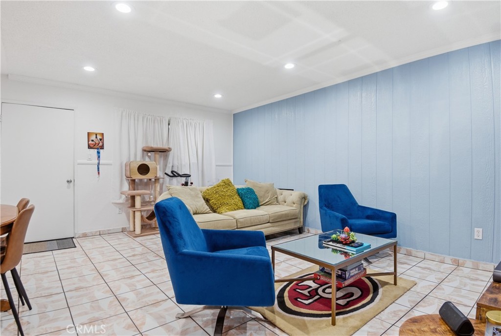 3301 Santa Fe Avenue, Unit 49 Long Beach, CA 90810 - Photo 9 of 26 a living room with furniture and a table
