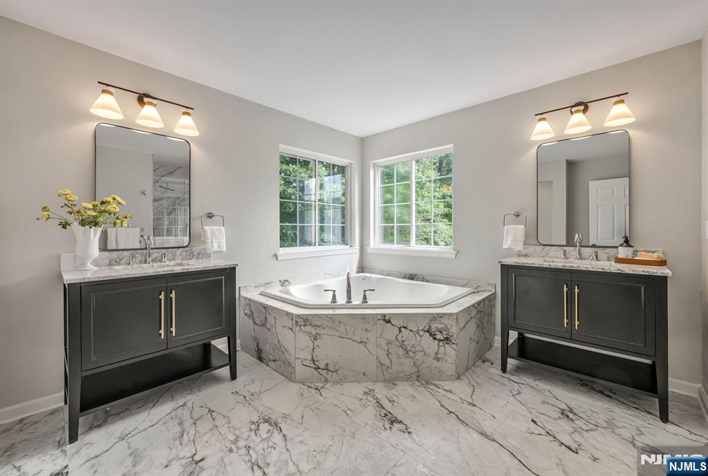 1 Winding Ridge Road Lake Hopatcong, NJ 07849 - Photo 33 of 50 a spacious bathroom with a sink double vanity and a mirror
