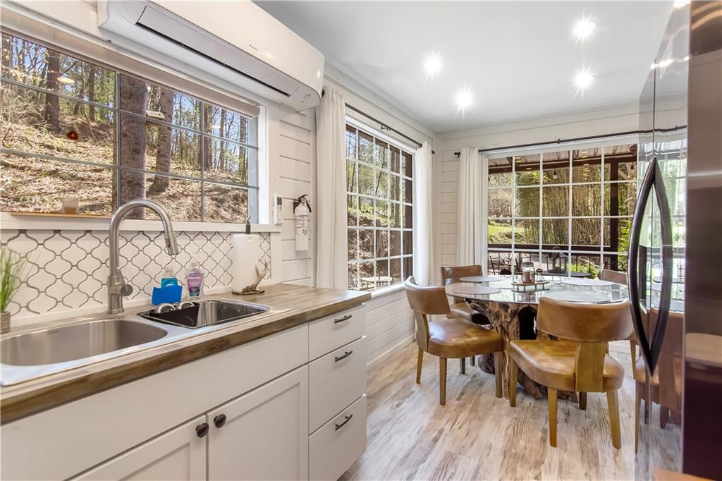 2308 Carver Mill Road Talking Rock, GA 30175 - Photo 15 of 33 a kitchen with sink a large window and chairs