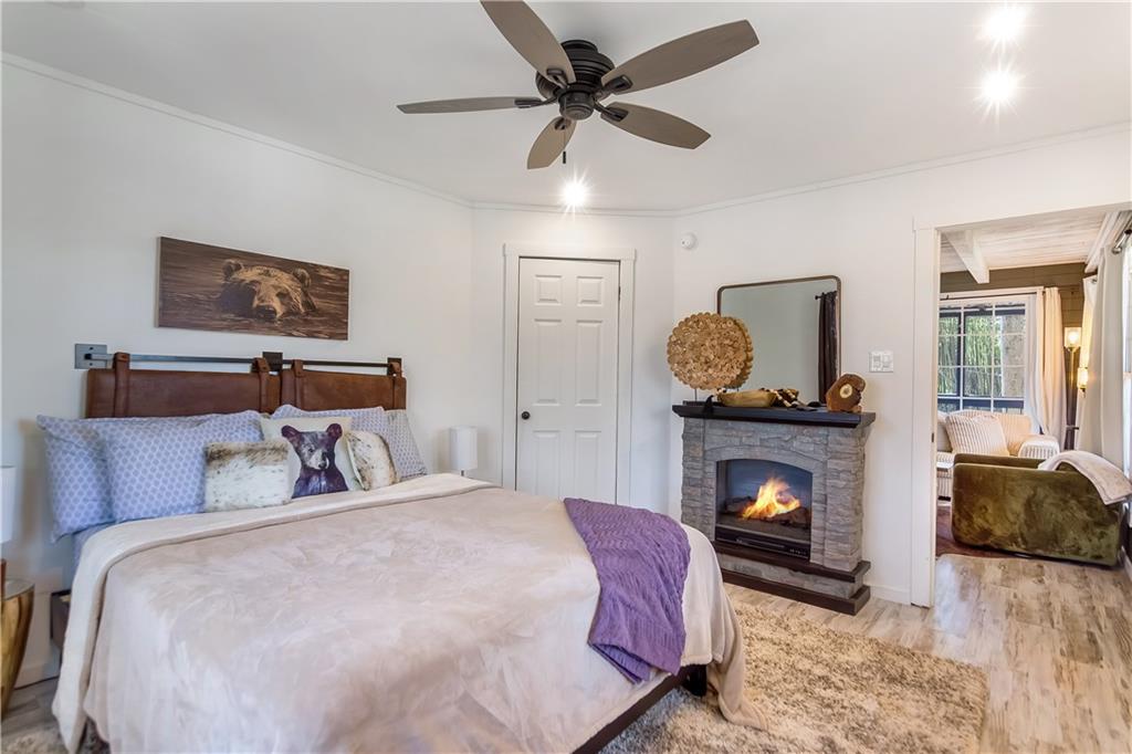 2308 Carver Mill Road Talking Rock, GA 30175 - Photo 20 of 33 a bedroom with a bed and a fireplace