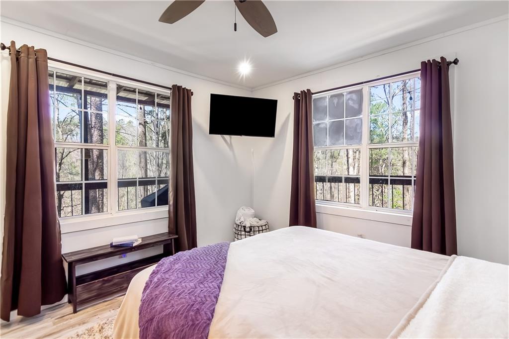2308 Carver Mill Road Talking Rock, GA 30175 - Photo 21 of 33 a bedroom with a large bed and a large window