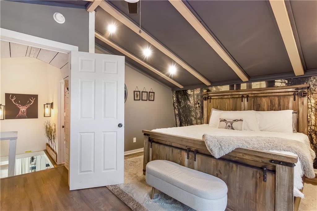 2308 Carver Mill Road Talking Rock, GA 30175 - Photo 29 of 33 a bedroom with a bed and wooden floor