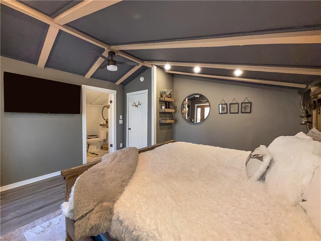 2308 Carver Mill Road Talking Rock, GA 30175 - Photo 31 of 33 a bedroom with a bed and a tv