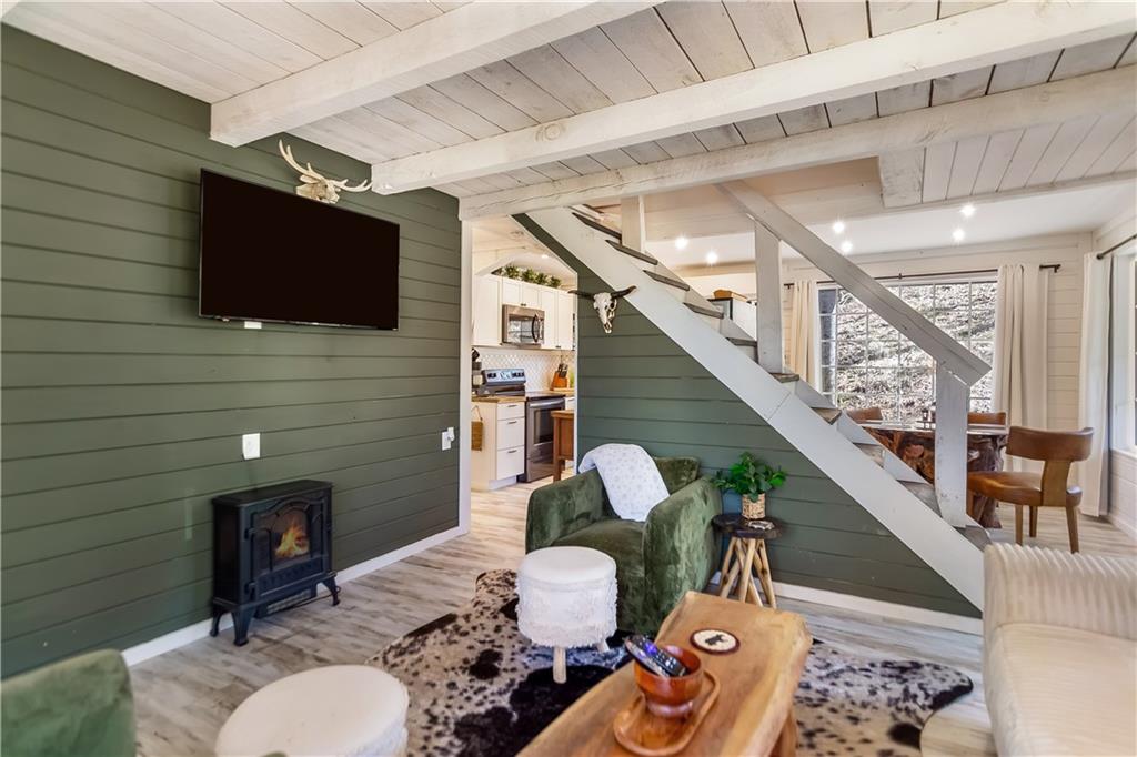 2308 Carver Mill Road Talking Rock, GA 30175 - Photo 7 of 33 a living room with furniture and a flat screen tv