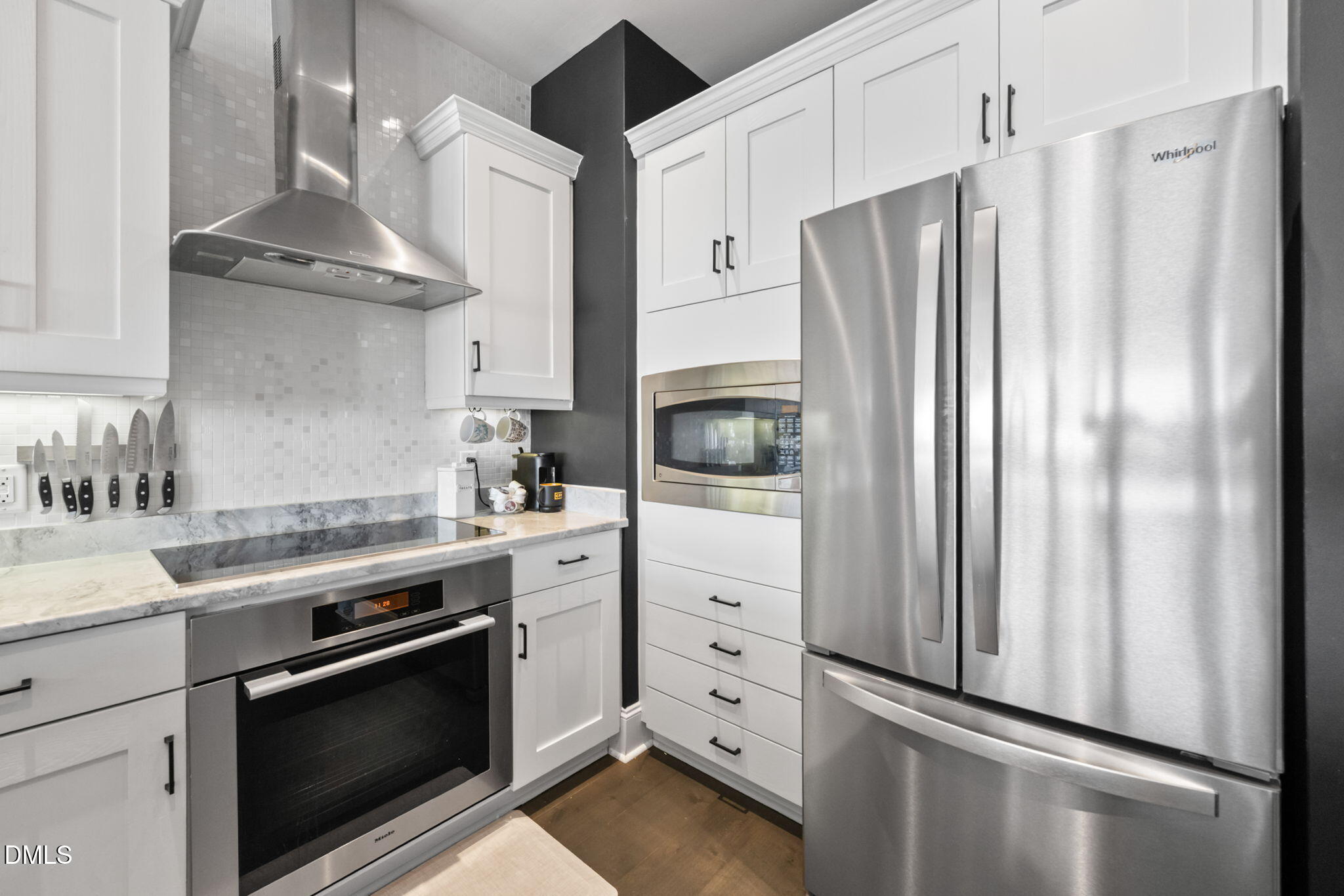 400 West North Street, Unit 1218 Raleigh, NC 27603 - Photo 6 of 41 a kitchen with stainless steel appliances a refrigerator sink and stove