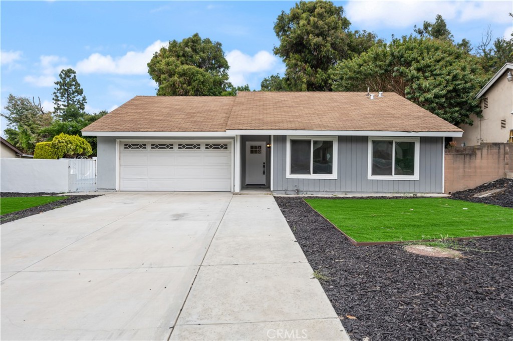 18578 Fieldbrook Street Rowland Heights, CA 91748 - Photo 1 of 20 a front view of a house with a yard and garage