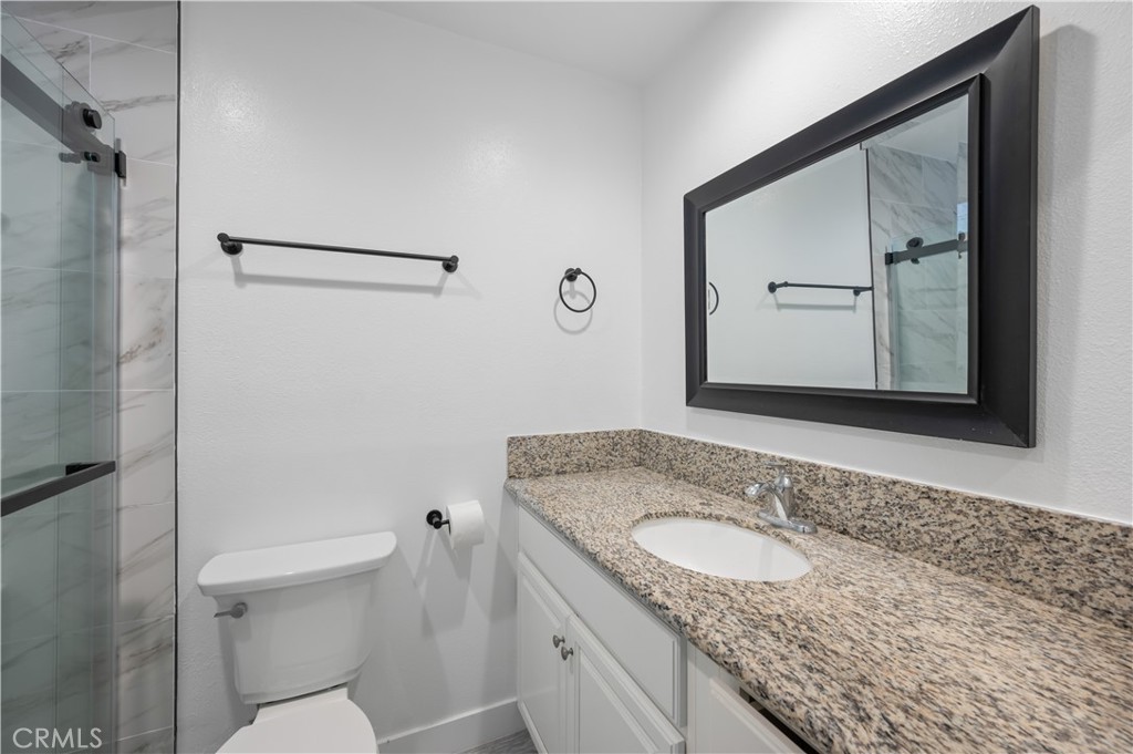 18578 Fieldbrook Street Rowland Heights, CA 91748 - Photo 13 of 20 a bathroom with a granite countertop sink toilet and shower