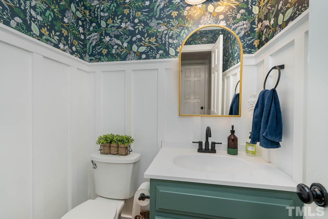 108 Donna Place Cary, NC 27513 - Photo 12 of 30 a bathroom with a toilet sink and mirror